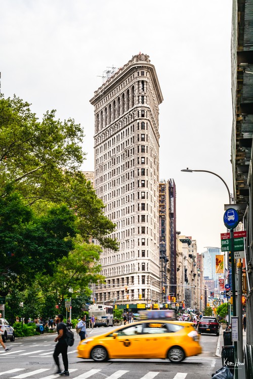 Flat Iron Building With Taxi Motion Blur