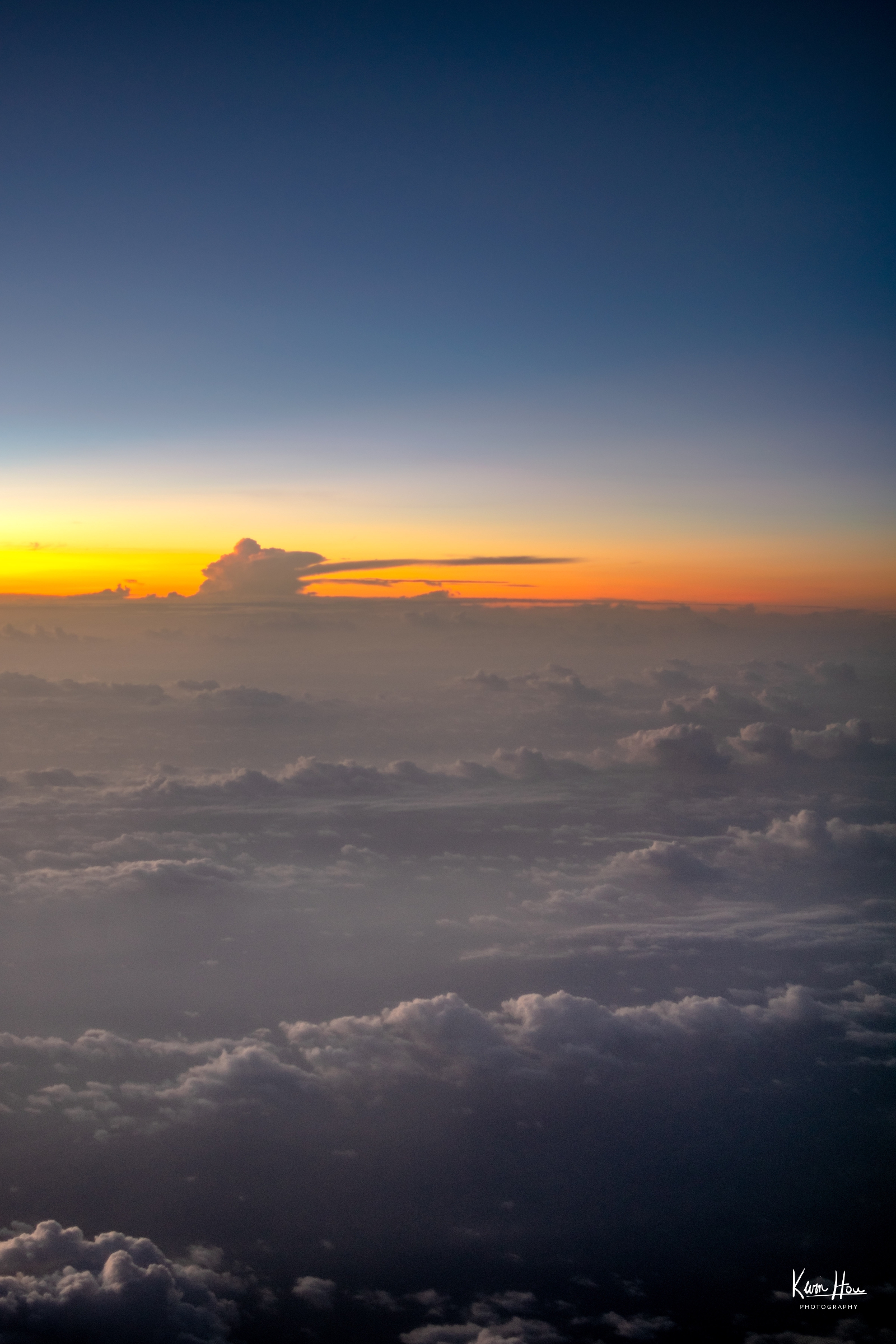 Sunrise over the Clouds from an Airplane