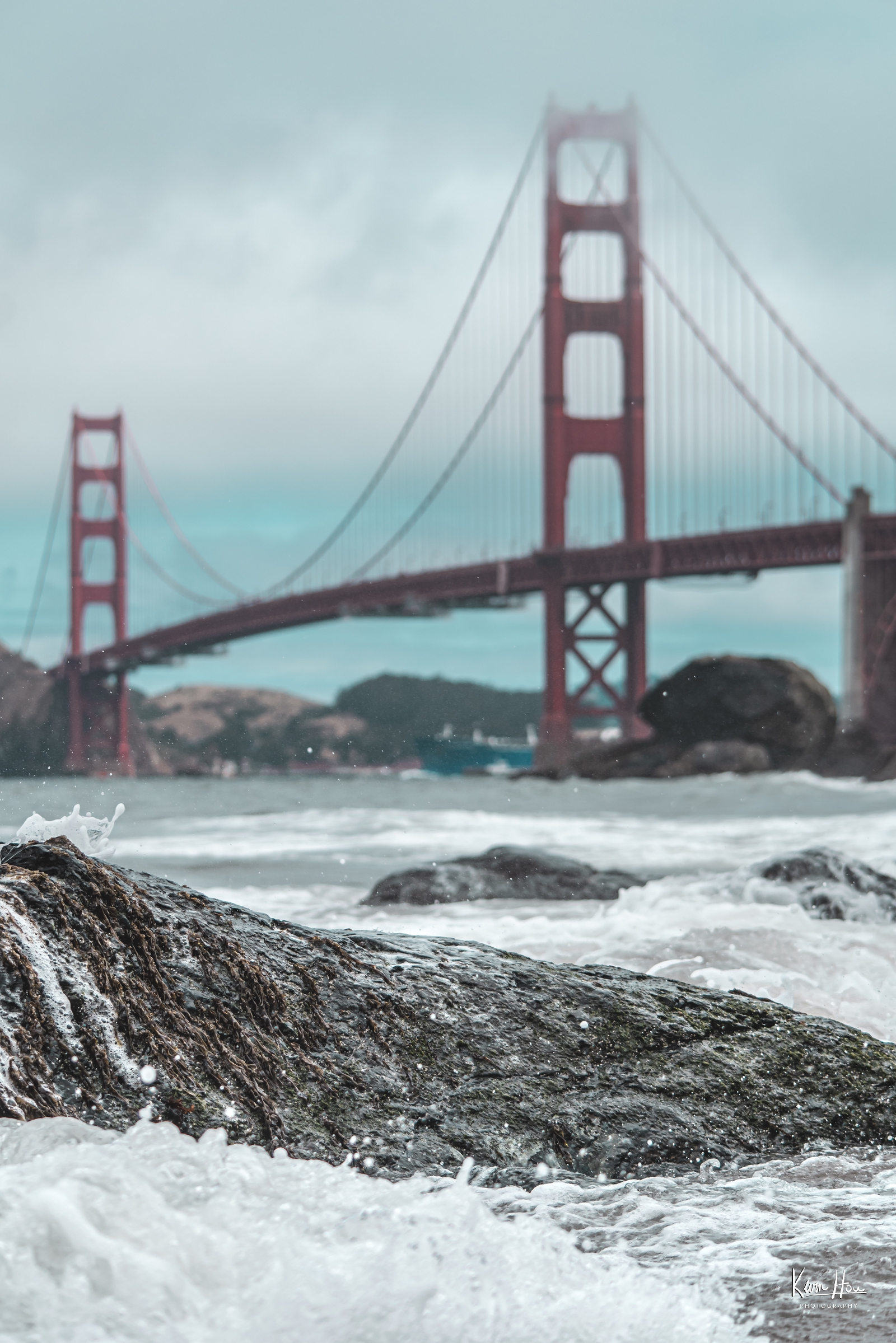Wave and Rock in Foreground, Golden Gate Bridge in Background