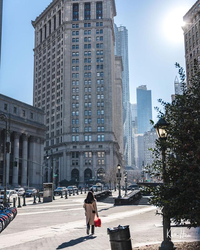Woman Walking Through Financial District